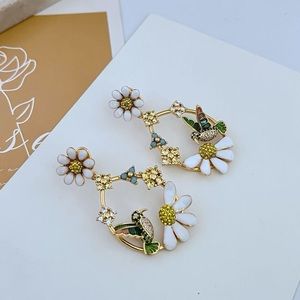 Kate Spade Gold and White Floral Earrings